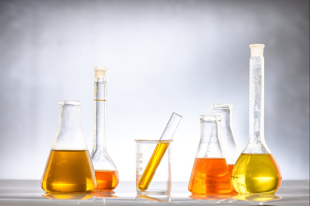 Different types of diesel fuels in beakers including biodiesel and blended fuel
