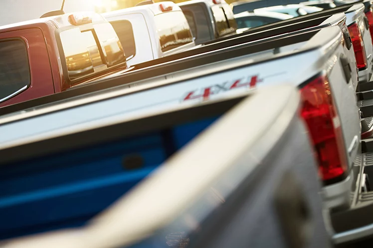 Line of pickup trucks at a dealership